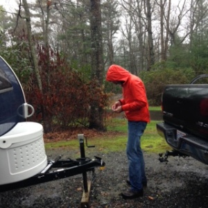 Maybe we should hire ourselves out as rainmakers. It seems like we inevitably attract precipitation of all kinds, sometimes even inside our trailer. After I snapped this photo Chuck strongly suggested I quit fooling around and at least hold the umbrella over him.